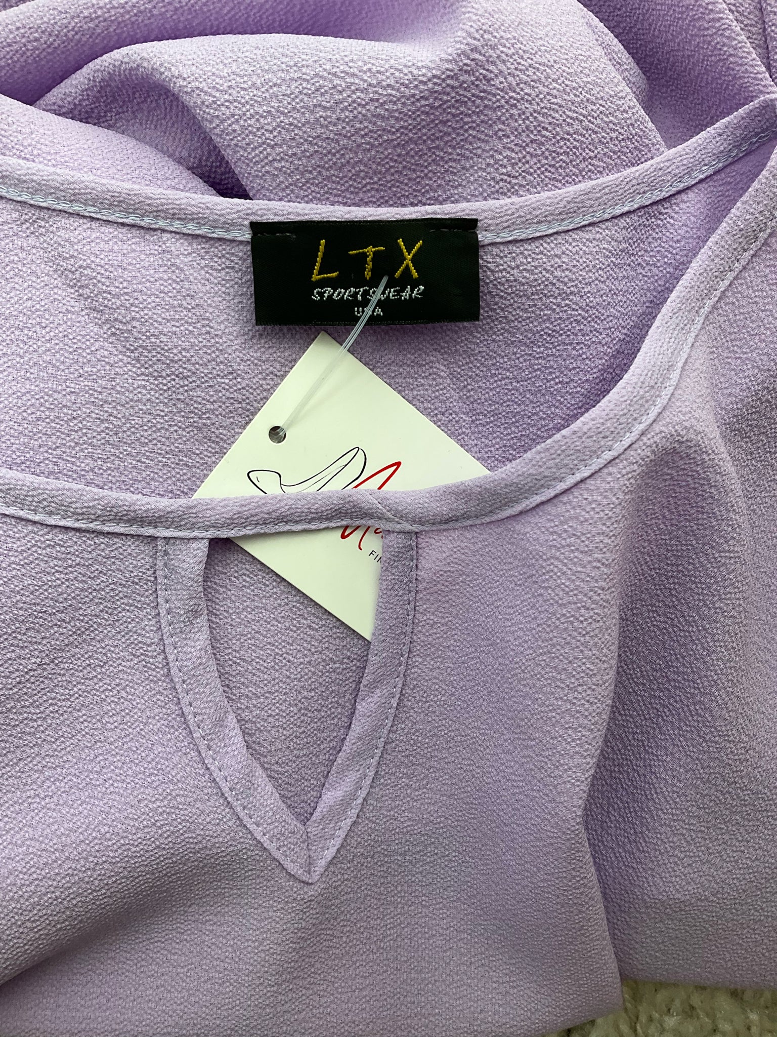 LTX Sportswear lavender solid pre-owned ladies top, size large, featuring a bohemian casual tunic style.