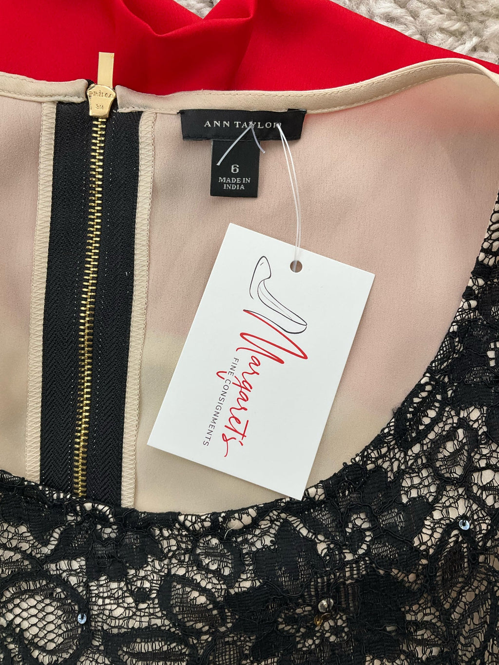 Ann Taylor sleeveless black lace top with colorblock design and embellishments, size 6, displayed on a neutral background.