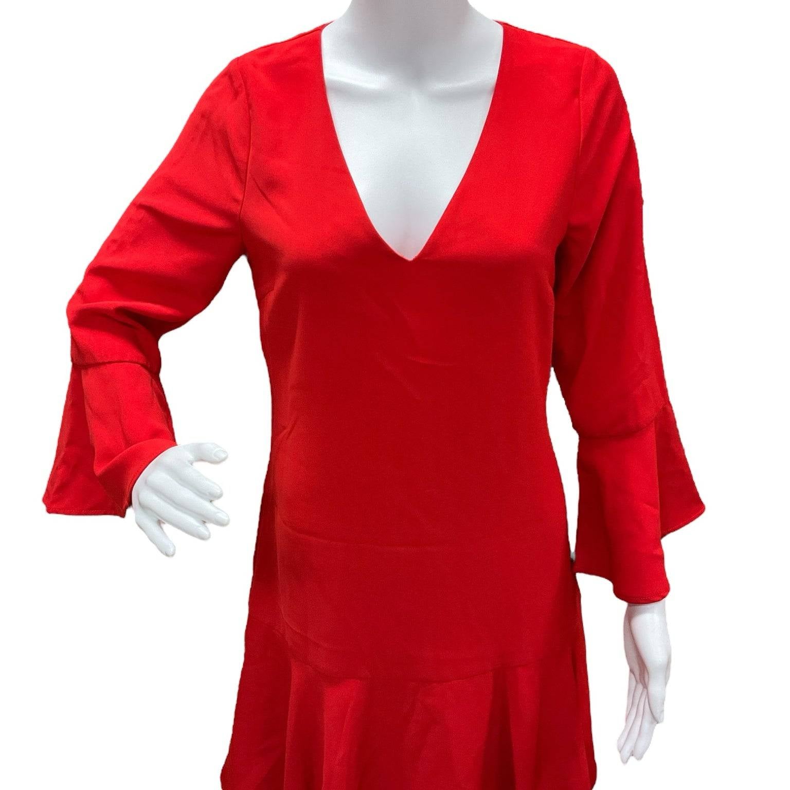 New With Tags Julie Brown red solid dress size 4 displayed on mannequin, featuring flared sleeves and ruffled hem. Shop at Margaret’s Fine Consignments.