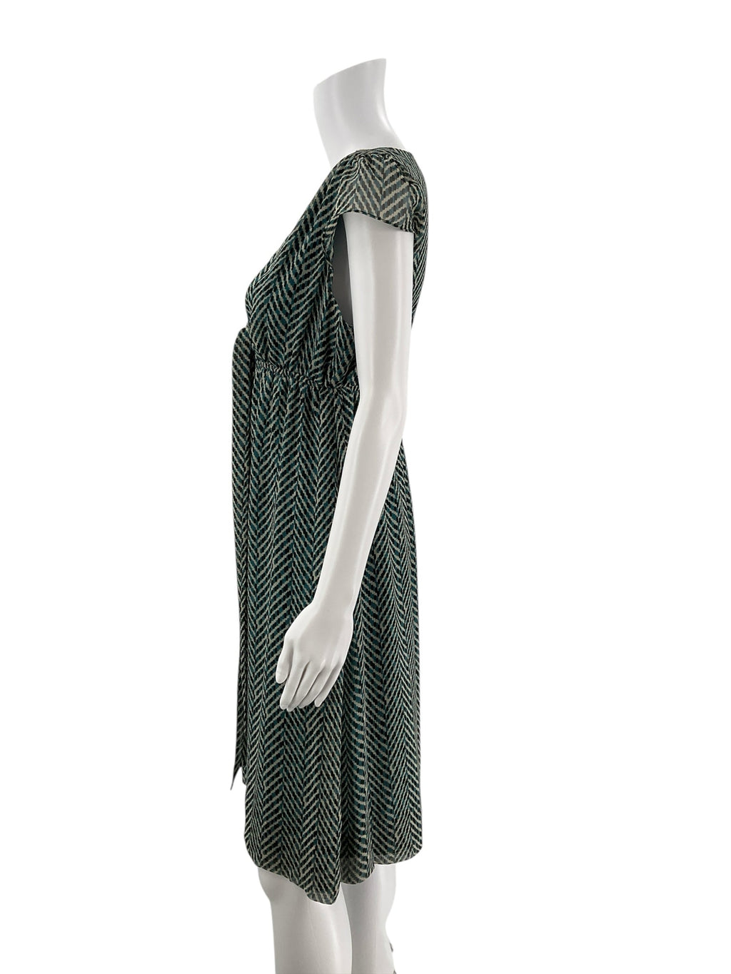 Side profile of New York & Co pre-owned teal/cream chiffon dress, highlighting cap sleeves and flattering fit and flare silhouette.