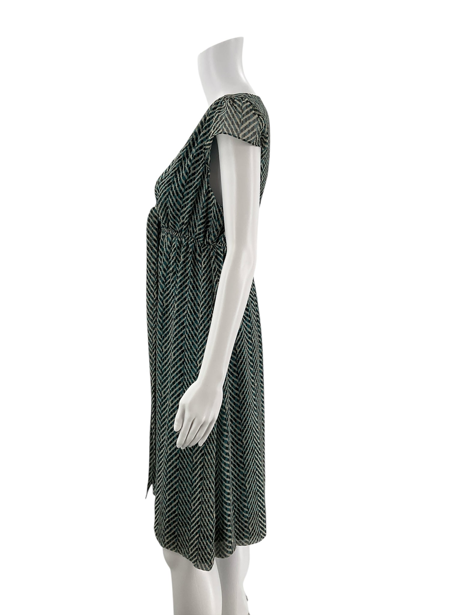 Side profile of New York & Co pre-owned teal/cream chiffon dress, highlighting cap sleeves and flattering fit and flare silhouette.