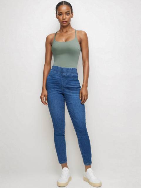 Talbots Jeans Size 8 styled on model with high-rise fit and tapered leg, available at Margaret's Fine Consignments for a chic denim look.