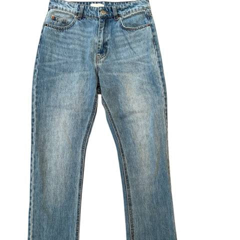 Flat lay of H&M Jeans Size 6 in light blue denim, gently used and sold at Margaret’s Fine Consignments. Classic straight-leg style.