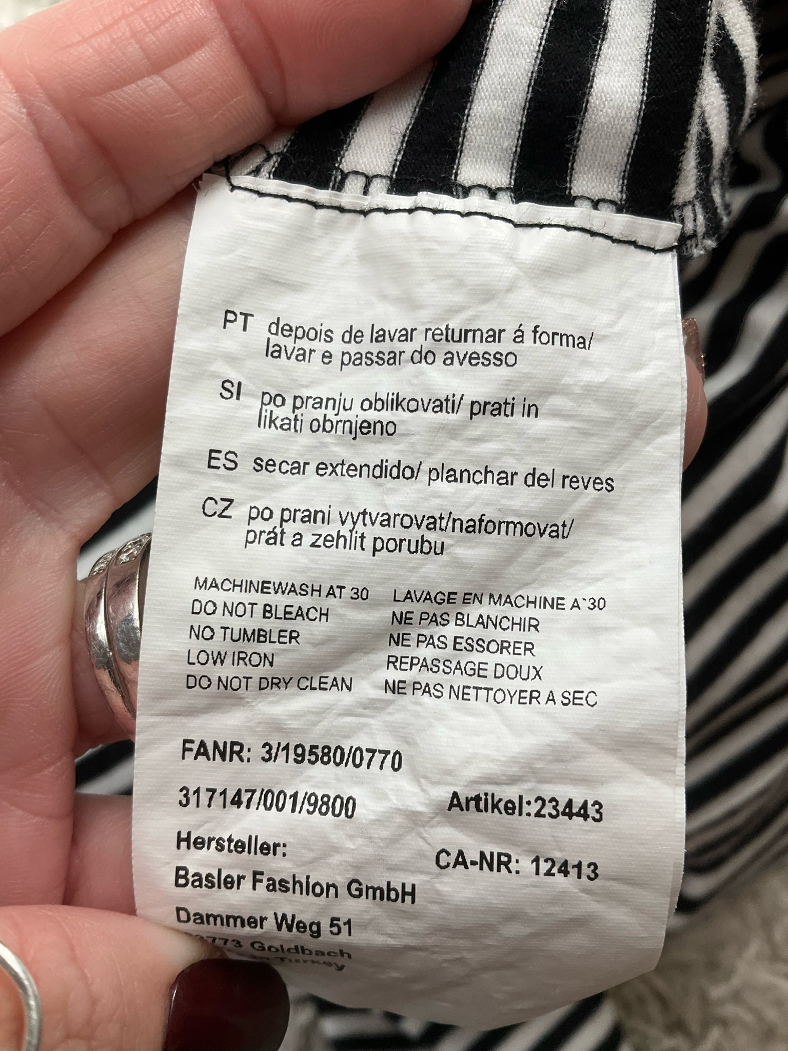 Basler pre-owned ladies top in white and black stripes, size large, featuring a classic, modern feminine style.