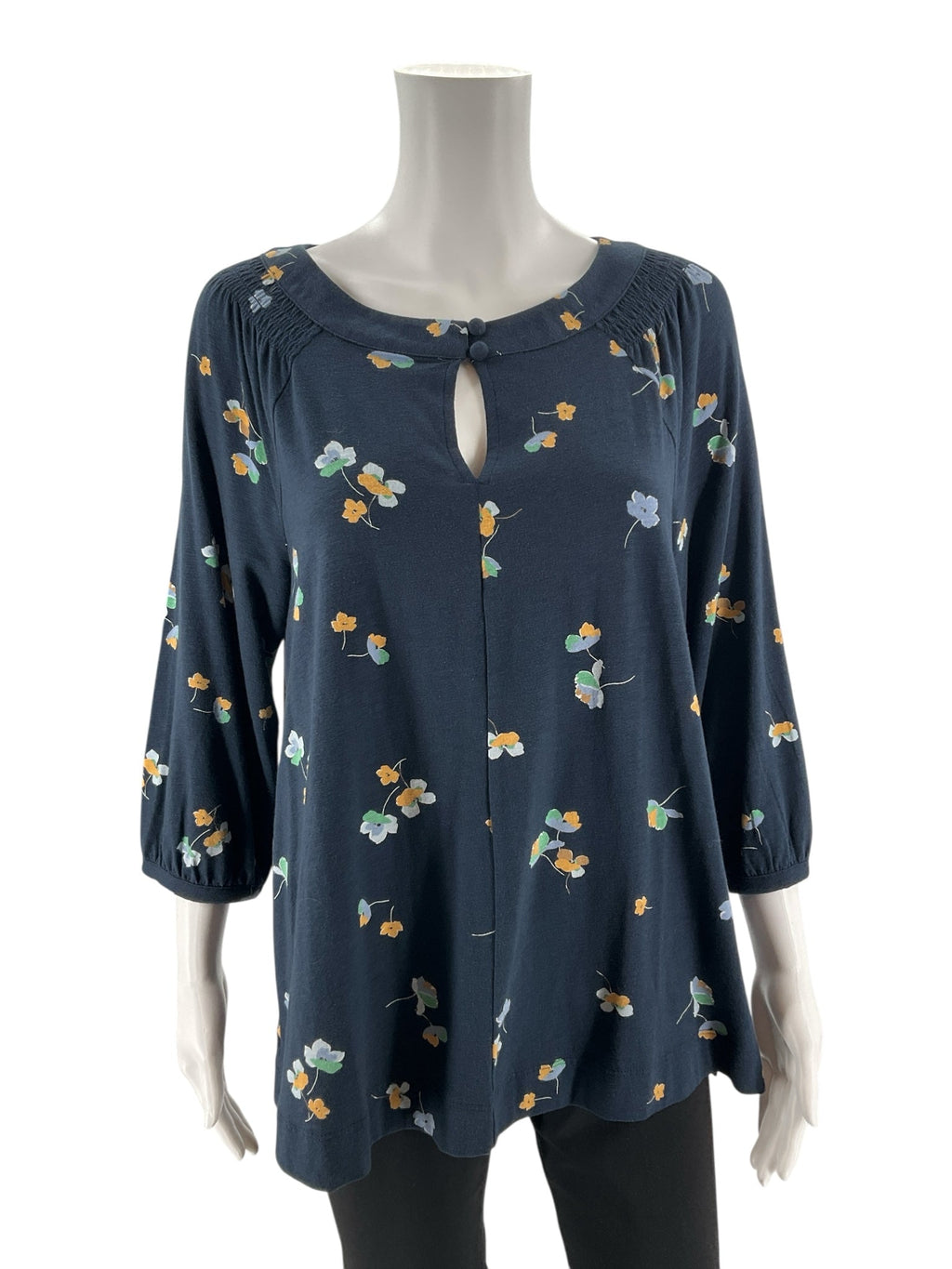 J. Jill pre-owned navy, yellow, and green floral tunic top with pintuck detailing, size small, displayed on a hanger.
