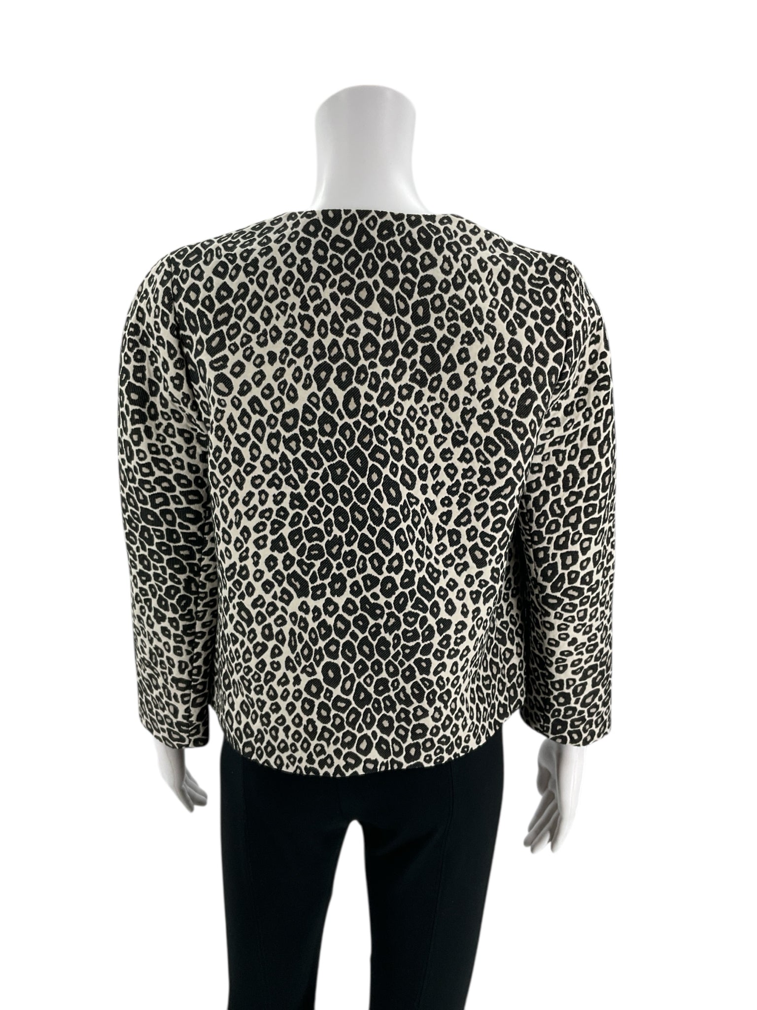 Back view of Ann Taylor Cream/Black Animal Pre-Owned Jacket - Size XS, highlighting the full animal print pattern and cropped silhouette.