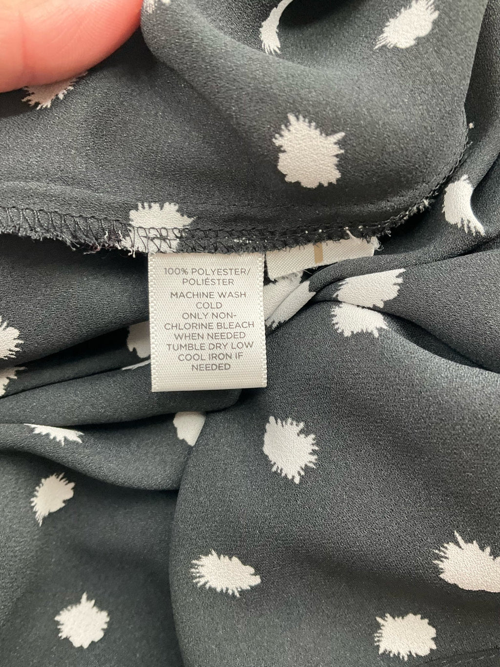 Ann Taylor LOFT black and white polka dot boatneck top, A-line style with high-low hem, size small for casual or business wear.