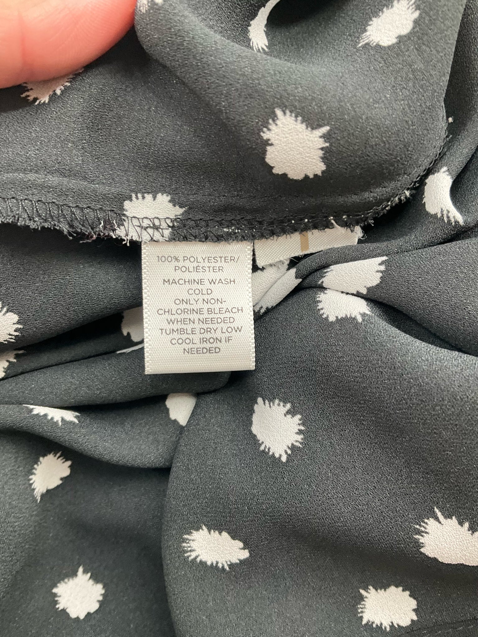 Ann Taylor LOFT black and white polka dot boatneck top, A-line style with high-low hem, size small for casual or business wear.