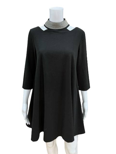 Close-up of Gracia Dress Size Small showing silver neckline detail and flowy black fabric. Shop this elegant little black dress at Margaret’s Fine Consignments.