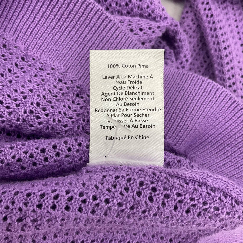 French version of care label on Talbots lavender mesh top, confirming 100% Pima cotton and gentle wash instructions.