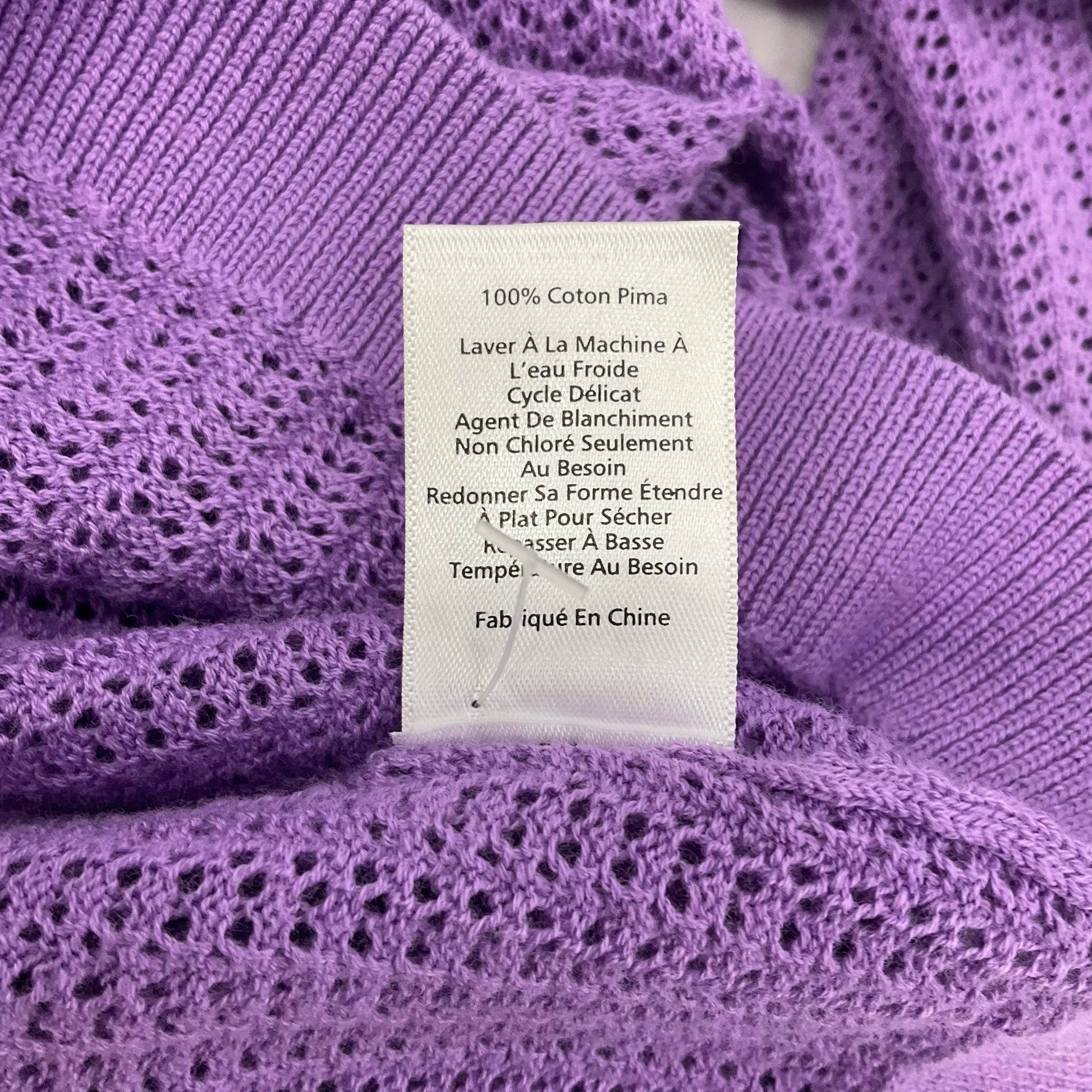 French version of care label on Talbots lavender mesh top, confirming 100% Pima cotton and gentle wash instructions.
