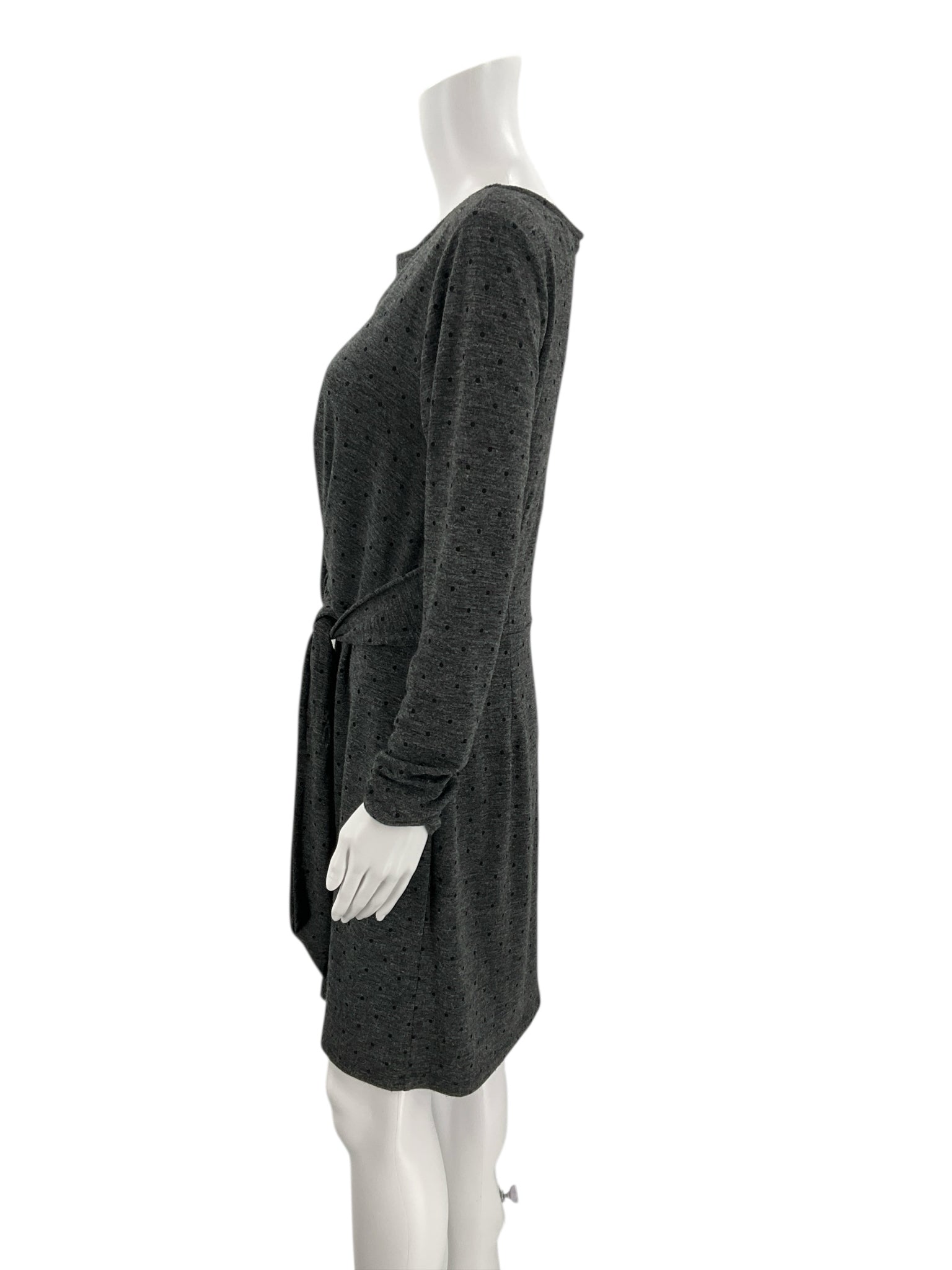 Side profile of Loft Gray/Black Polka Dot Pre-Owned Dress - Size Medium on mannequin, showing long sleeves and knee-length cut.