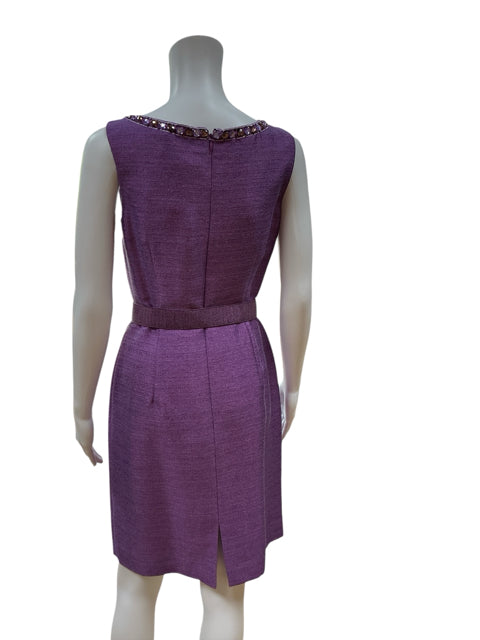 Back view of Antonio Melani purple sheath dress with rear slit and rhinestone neckline detail, showcasing elegant tailoring and structure.