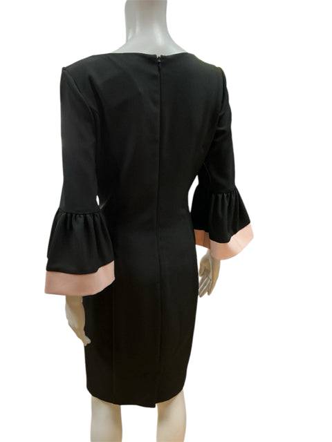 Back view of Ralph Lauren Black Solid Dress Size 8 with zipper closure and pink-accented bell sleeves, sold at Margaret's Fine Consignments.
