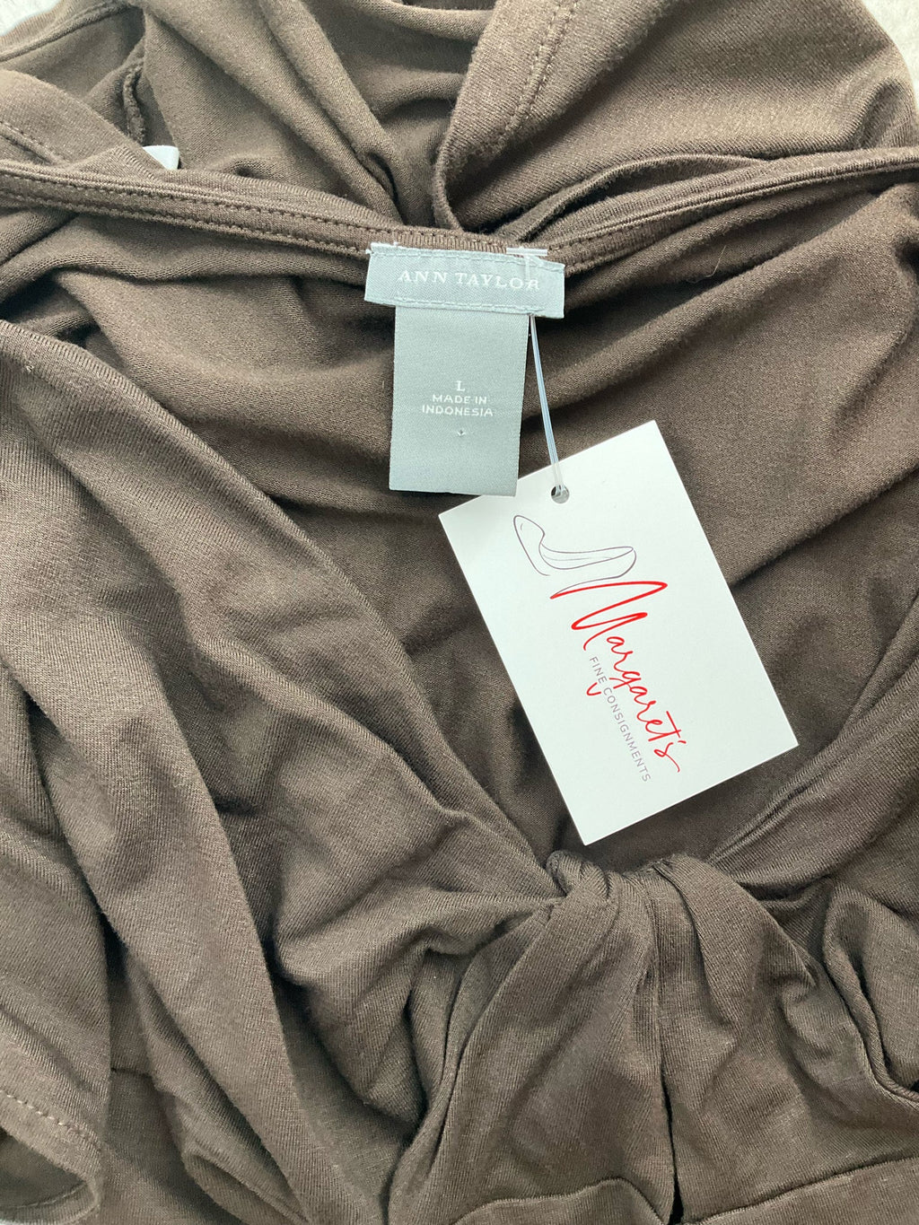 Ann Taylor brown knot front cap sleeve top in size large, featuring a twist front design and soft jersey knit fabric.