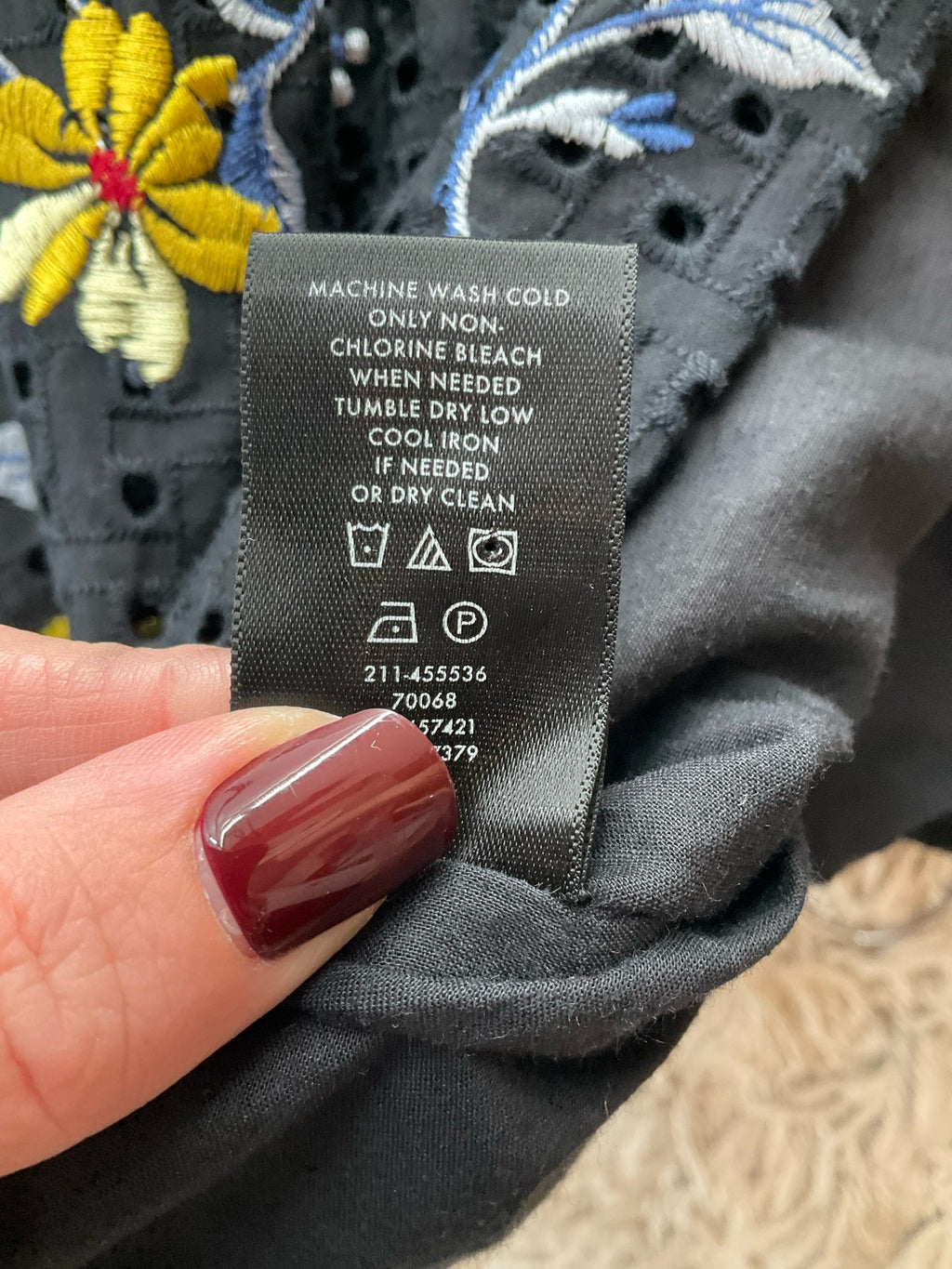 Ann Taylor black and multi floral embroidered ladies top, size XL, showcasing a bohemian and feminine casual style.