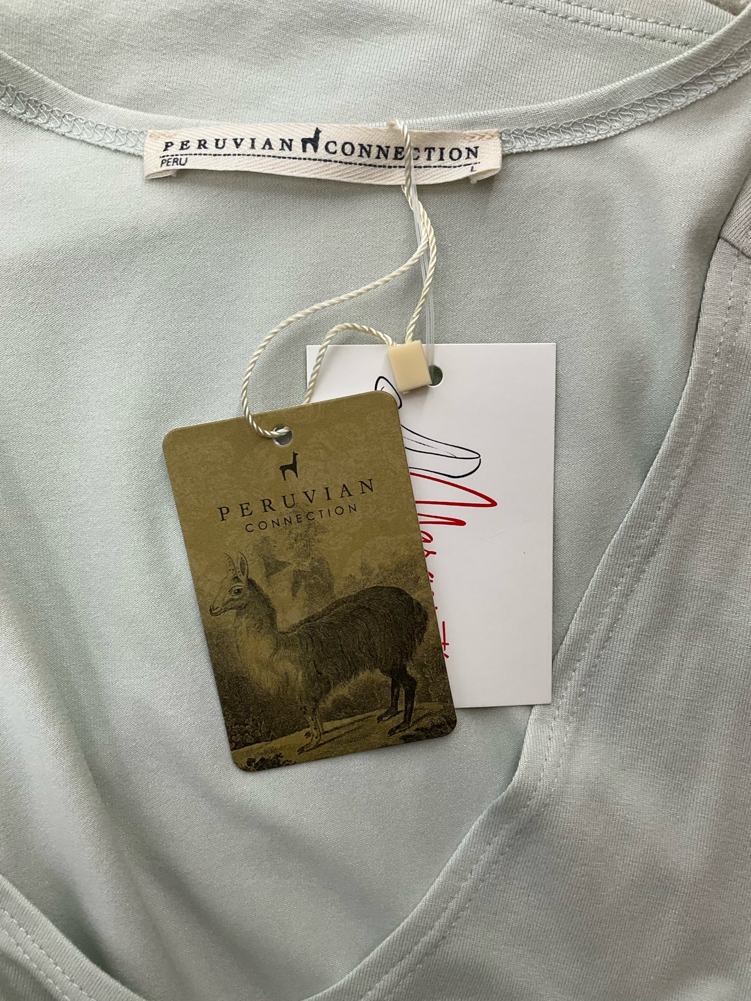 Mint green scoop neck tank top by Peruvian Connection, sleeveless and A-line, size large, displayed on a neutral background.