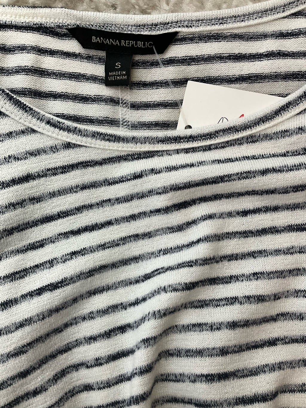 White and blue striped Banana Republic short sleeve ladies top in size small with a boxy fit and casual style.