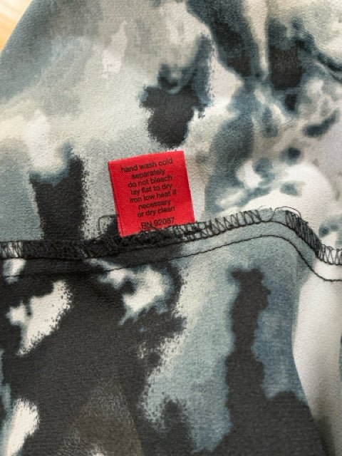 Close-up of care label on 5/48 Black/Cream/Gray Print Dress - Size XS. Indicates hand wash cold and RN 92087 for garment care instructions.